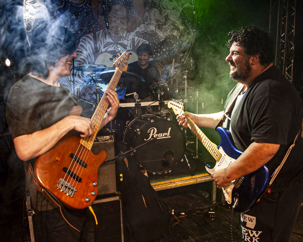 Ricardo Maranhão Trio performing live, with guitar, vocals and band performing on stage.